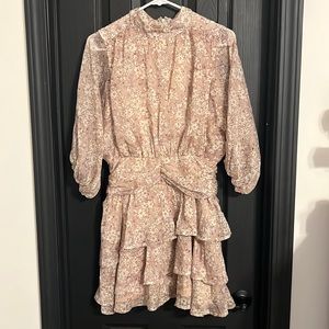 New with tags. Never worn. Beige floral dress with cinched waist.